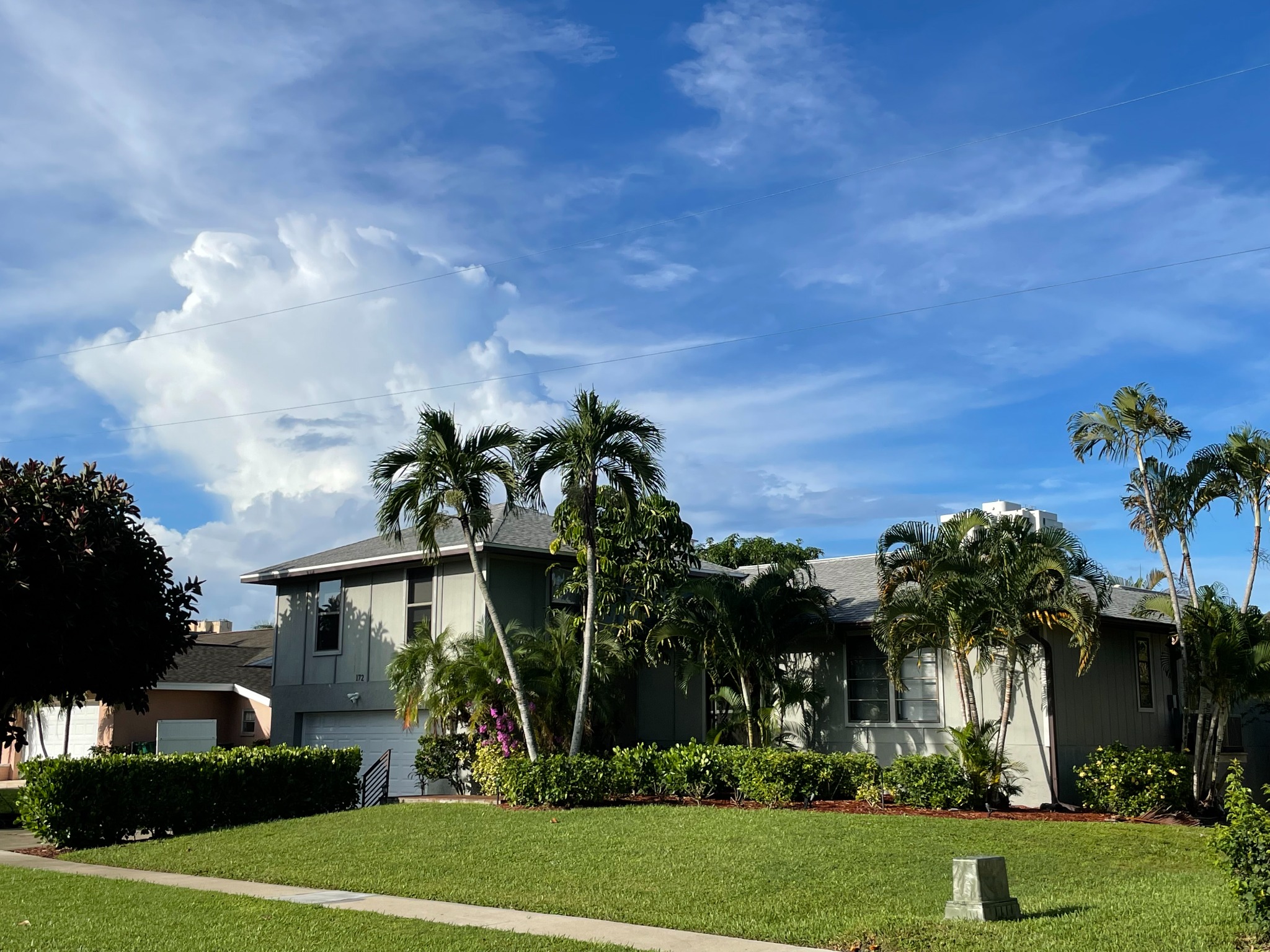 Two Blocks to Beach vacation home on Marco Island surrounded by tropical palms